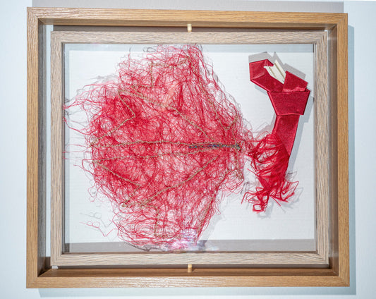 it is made from another bright red tie that has been shredded into a cloud out red threads with the suggestion of a maple leaf picked out in gold thread. it king of looks like a maple leaf moth perched on the loud red tie branch. again it is a version of how Canada responded to the USA's recent aggression. the tie is trumps red and made in china. it can be viewed from both sides