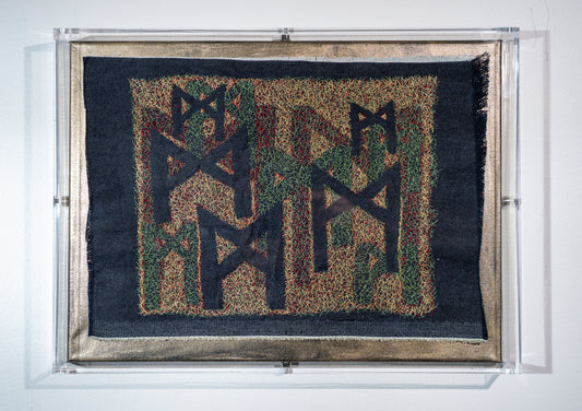 this is a very detailed piece consisting of three layers of embroidery that reveal mulitple versions of the rune mannaz in the spaces left empty. on frayed denim in tiny stitches to remind one that balance takes lots of tiny adjustments in a working world